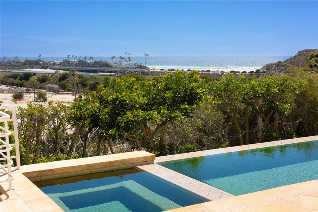 Pool terrace with ocean and lagoon views at 117 Via De La Valle